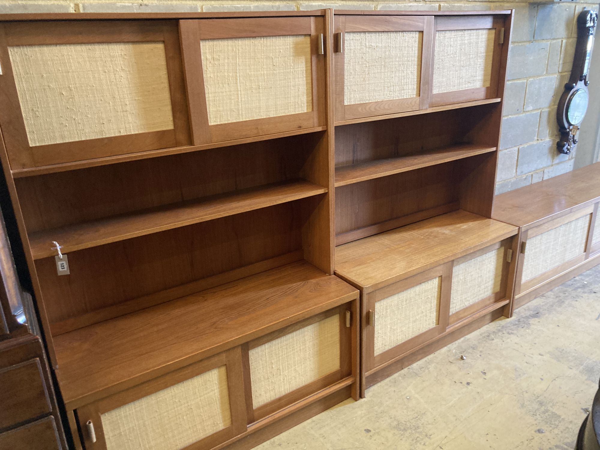 Three near-matching teak side cabinets,